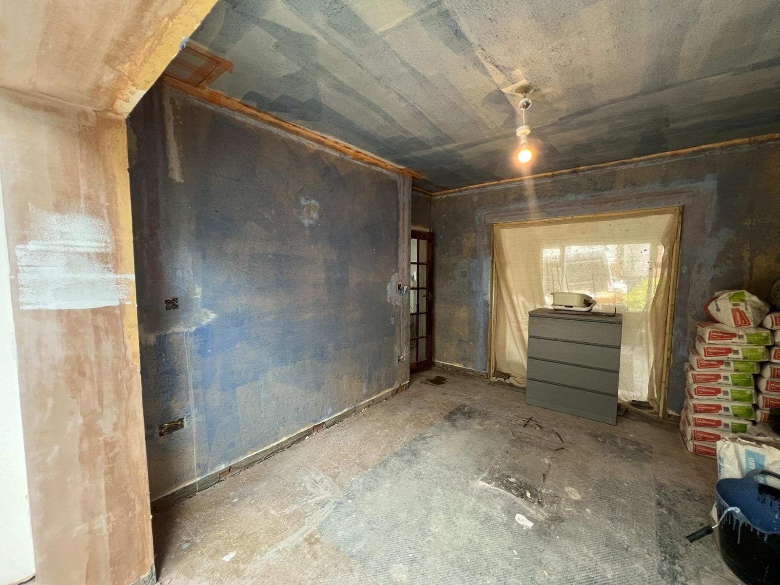 The room stripped back to bare walls and floor before the kitchen refit by Truscon